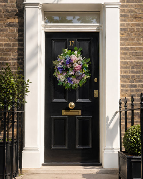 Blossoming Symphony peony wreath on a black London Georgian door with brass furniture