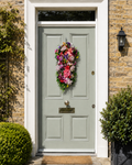 Pastel Pink Rose and Lavender vertical door swag on a sage green Georgian door, yellow stock brick
