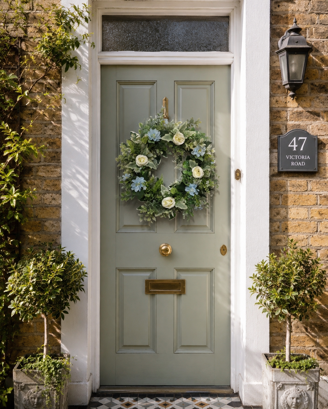 After the Frost ivory and sage wreath on a sage green Georgian townhouse door at Victoria Road